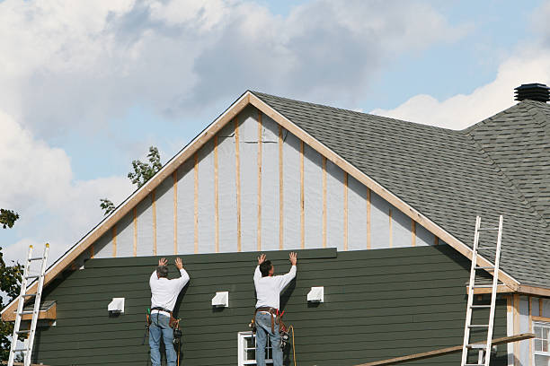 Professional Siding Replacement technician working in East Liberty, OH